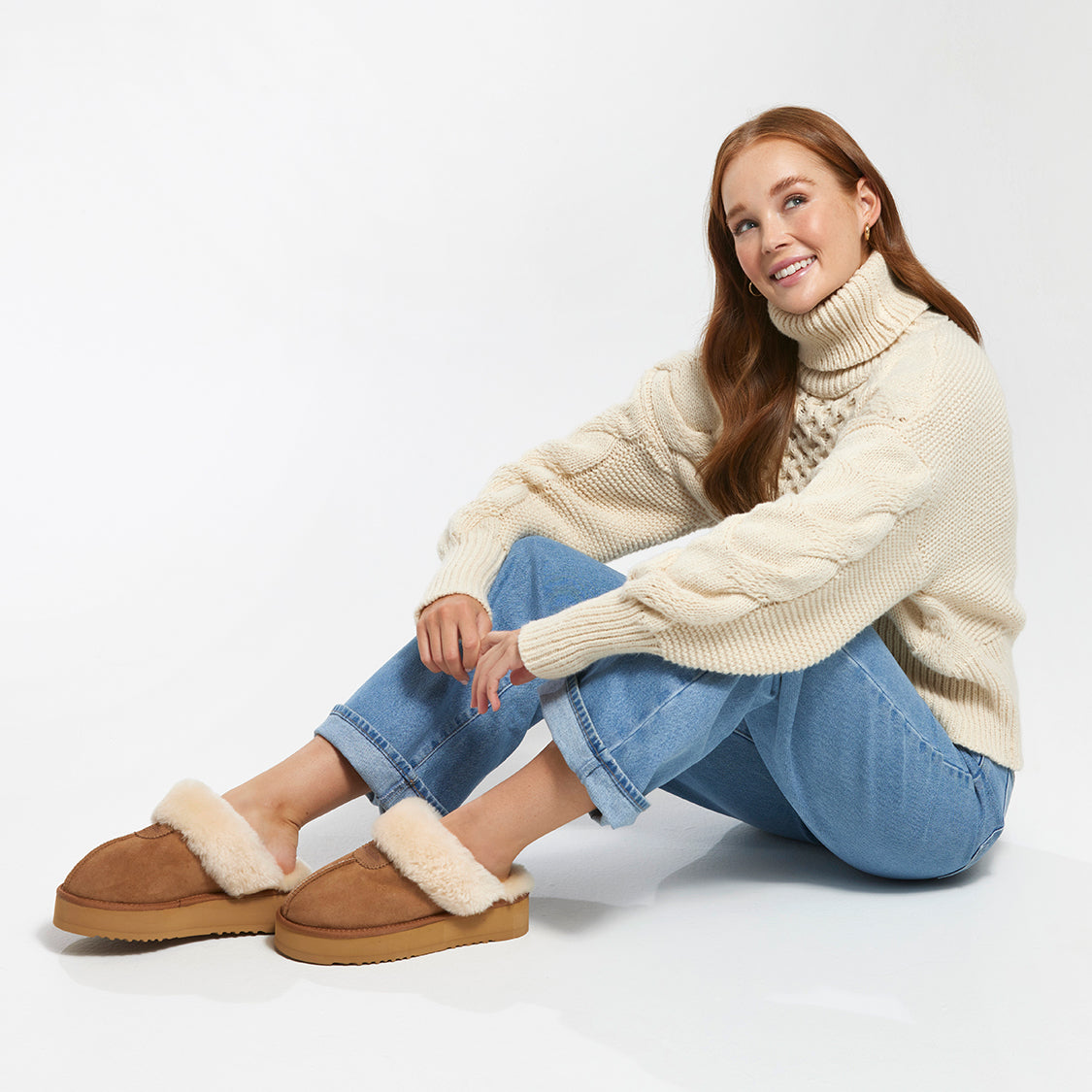 A girl wearing Charlotte Platform Sheepskin Scuff