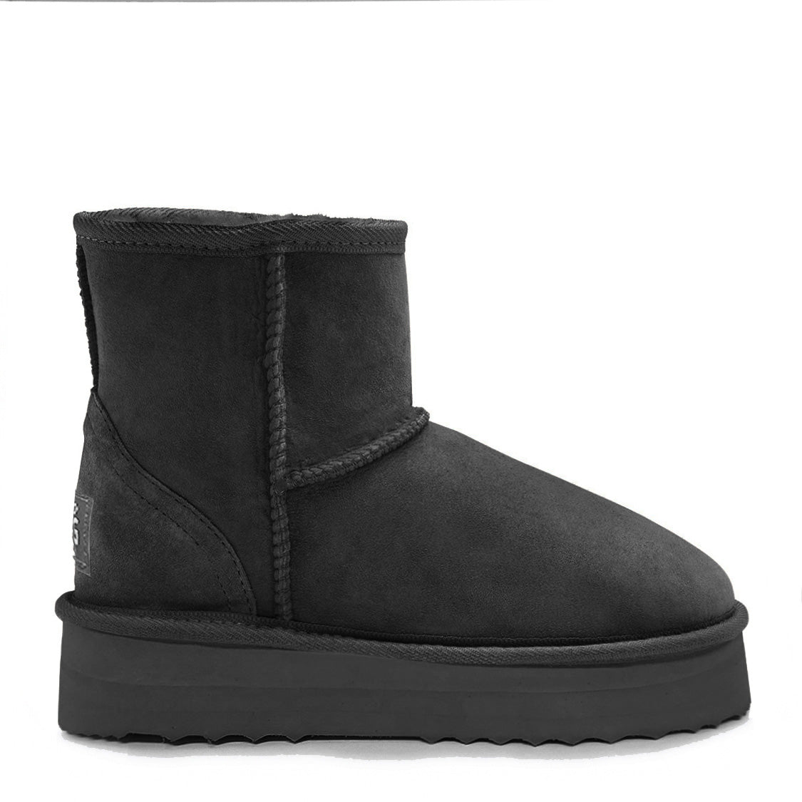 Model wearing Ultra Short Platform Uggs with white socks and leggings for a trending winter look.